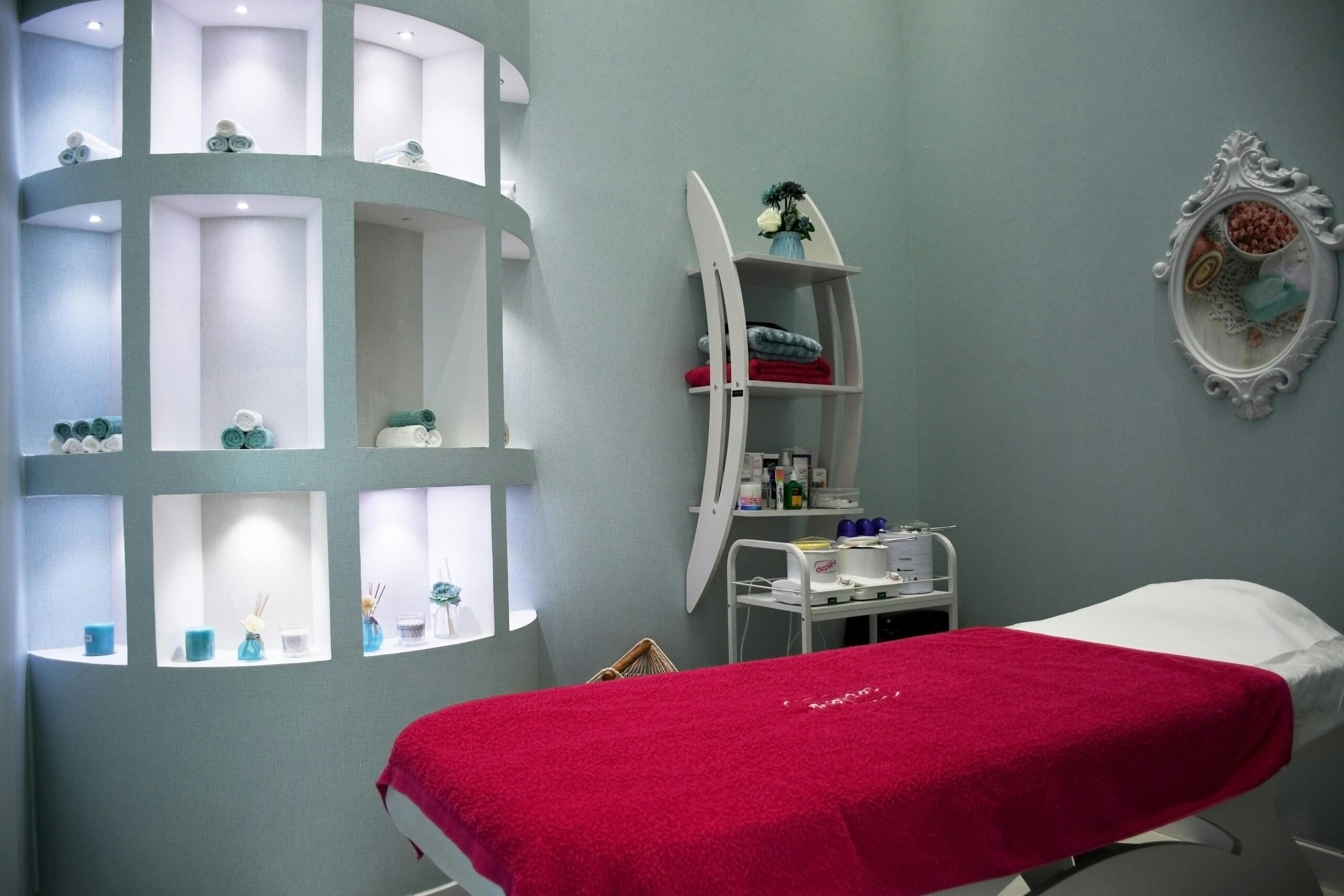 Modern spa room in Abu Dhabi with stylish decor, ambient lighting, and luxurious fittings.
